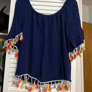 Navy blue top with fringed arms and bottom.